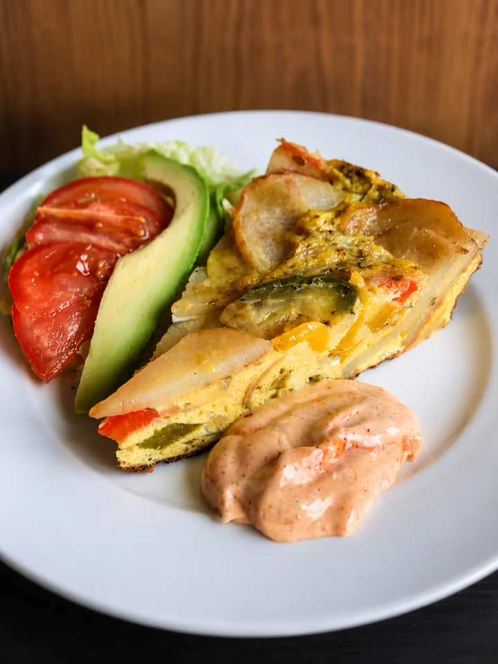 A freshly prepared cafe plate with salad